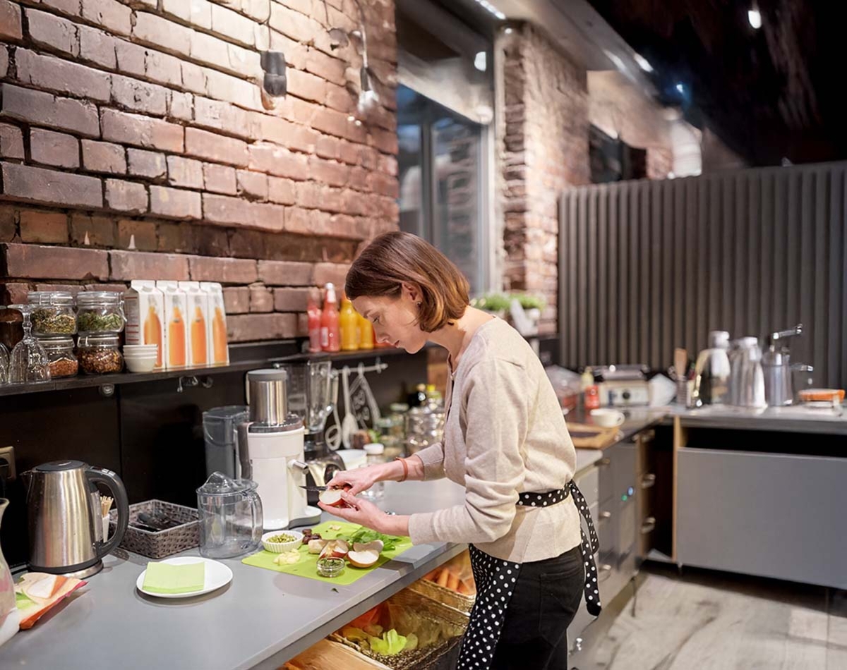 Woman Cooking In Kitchen