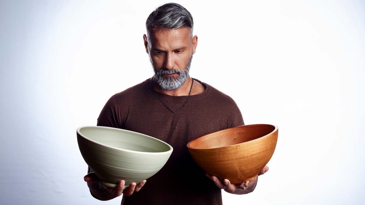 Man Holding Two Bowls One In One Out Rule